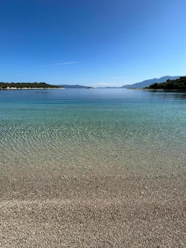a view of a beach with the water at 8 Homes in Meganisi