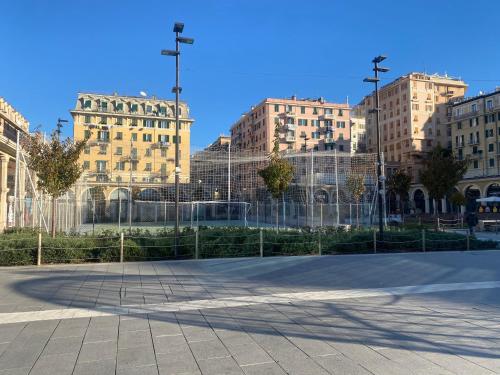 un gruppo di edifici alti in un parcheggio di LEONE VACANZE a Genova