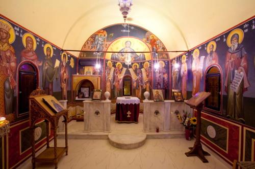 a church with a large painting on the wall at Castello Di Cavallieri Suites & Spa - Adults Only in Faliraki