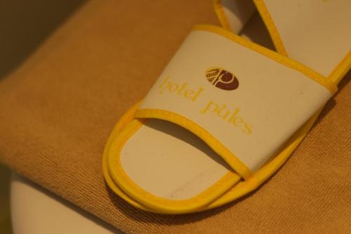 a close up of a cell phone sitting on a table at Hotel Pules in Yogyakarta