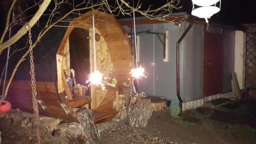 a wooden boat being built in a house at night at Belle ILE in Lychen
