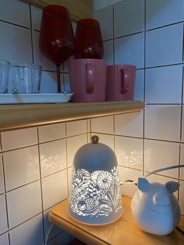 a table with a tea pot and a tea kettle at Suite Neve in Madesimo