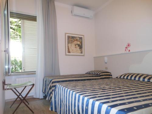 Postel nebo postele na pokoji v ubytování Hotel Stipino