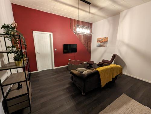 Μια τηλεόραση ή/και κέντρο ψυχαγωγίας στο Cozy 1 Bed Apartment with Kitchen in Town