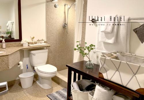 a bathroom with a toilet and a shower and a sink at Ocean View Waikiki Luxury Ilikai Free Parking in Honolulu