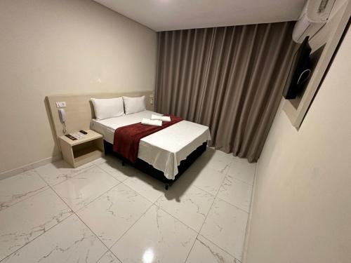 Ein Bett oder Betten in einem Zimmer der Unterkunft Hotel Flex Tatuapé