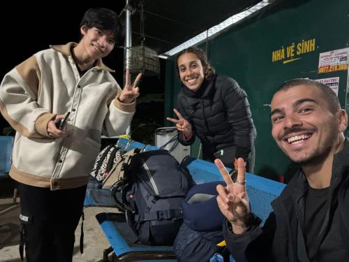 three people making the peace sign with their hands at Moc's House bắc hà in Bắc Hà