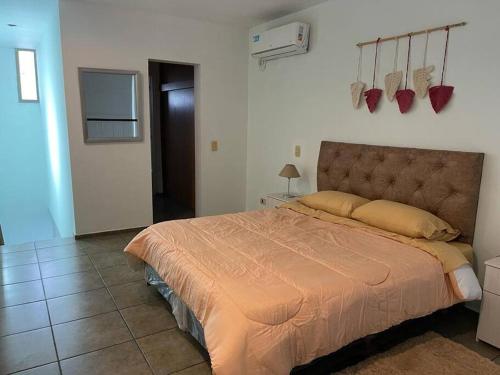 a bedroom with a large bed in a room at Simplemente Mendoza ! Unica ! in Godoy Cruz