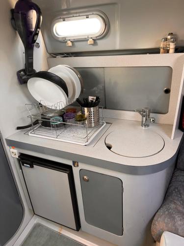 a kitchen in an rv with a sink at Bateau plaisance hotel Antibes in Antibes