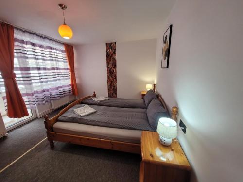Ένα ή περισσότερα κρεβάτια σε δωμάτιο στο Morrison Home Covasna