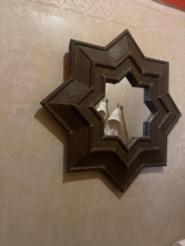 a black mirror with a reflection of a wedding couple at RIAD DAR NAOMI in Marrakech