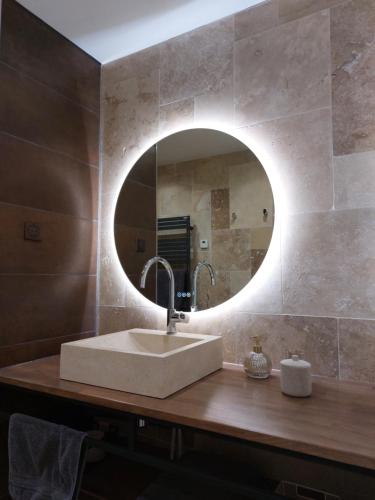 a bathroom with a sink and a mirror at Urbs Amiens Sud in Amiens