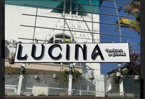 a sign that reads luenna in front of a building at Da Lat LUCINA Boutique Hotel in Da Lat