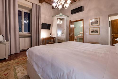 Ένα ή περισσότερα κρεβάτια σε δωμάτιο στο Villa Le Prata - Residenza Del Vescovo
