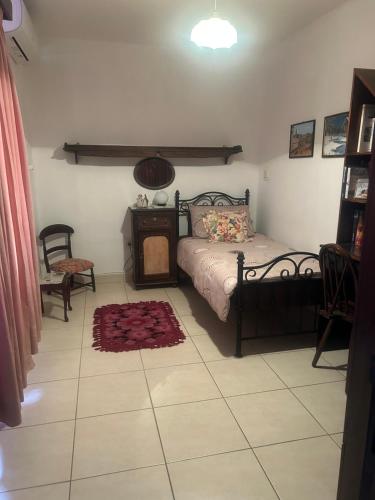 a bedroom with a bed and a table and chairs at Hidden Gems in Hamrun