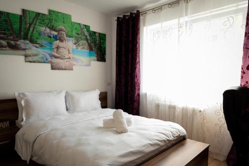 Postel nebo postele na pokoji v ubytování CH Apartments Coresi