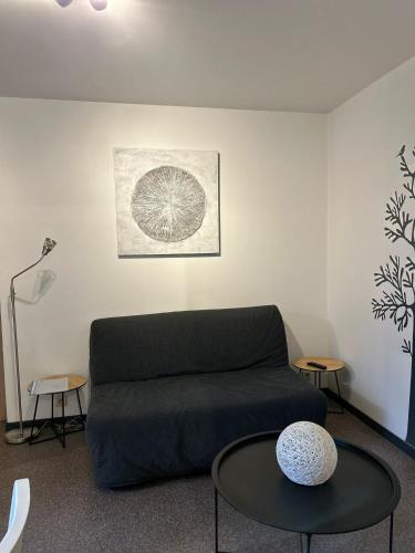 a living room with a couch and a table at Impasse 1 in Fosses-La-Ville