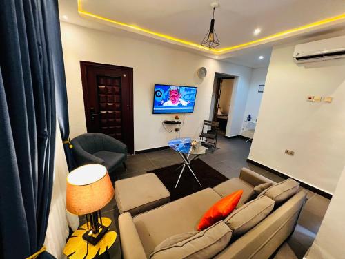 TV a/nebo společenská místnost v ubytování Karjel Homes Apartments