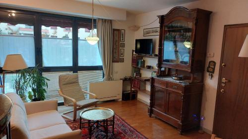 a living room with a entertainment center and a tv at Il Girasole in Milan