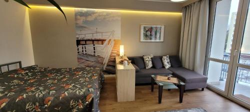 Posteľ alebo postele v izbe v ubytovaní Apartament na Heweliusza