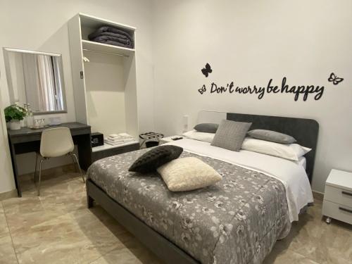 a bedroom with a bed with a happy anniversary sign on the wall at Toledo Point in Naples