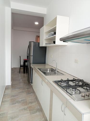 Una cocina o cocineta en Suite and Business