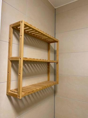 a wooden shelf hanging on a wall at Möblierte Wohnung Hannover List in Hannover