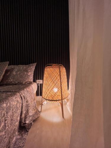 a bedroom with a bed and a chair in a room at The Patio at Monaco Tower in Lagundi