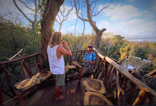 a man and a woman standing on a wooden bridge at Raindance in Santa Cruz