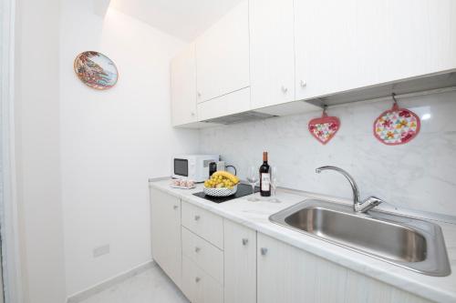 Kuchyň nebo kuchyňský kout v ubytování La Casa del Marinaio