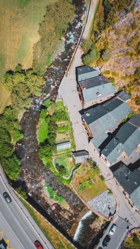 an aerial view of a parking lot next to a road at Casa amb molt encant i tranquilitat. in Ansalonga