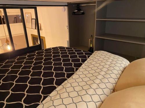 Tempat tidur dalam kamar di L'intimiste - SIPCO Immobilier - Netflix