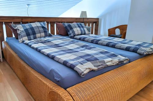 two beds sitting on top of a wicker couch at Haus Mitterbach Ferienwohnung Berglaune in Berchtesgaden