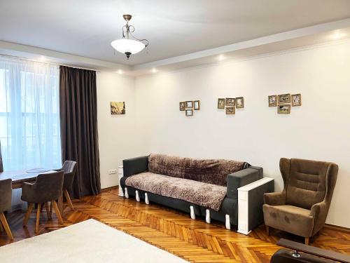 a living room with a couch and two chairs at Апарт-отель "ГАЛАГОВЪ" in Uzhhorod