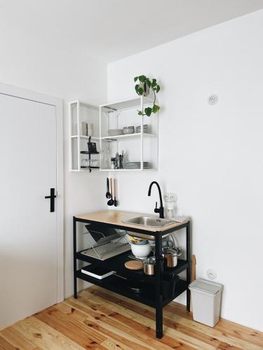a kitchen with a sink and a counter at powiew - adults only b&b pensjonat noclegi Świnoujście - Unterkunft Swinemünde - guesthouse tennis garden breakfast at baltic sea in Świnoujście