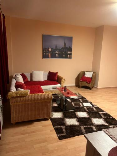 a living room with a couch and a table at Innenstadt Lübeck Ferienwohnung in Lübeck