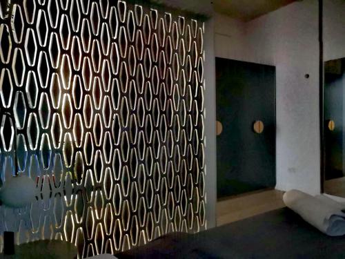 a wall with a black and white pattern on it at Unique City Centre Apartments in Nicosia
