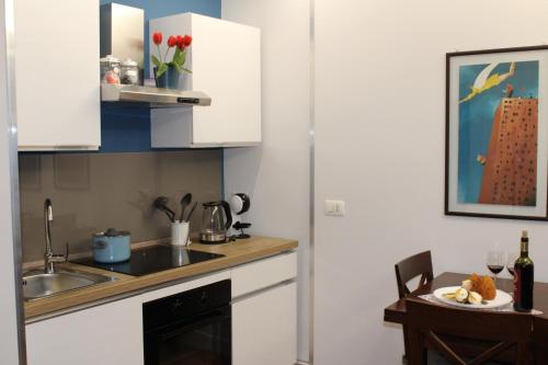A cozinha ou cozinha compacta de GeLiRó Apartment Catania Centro