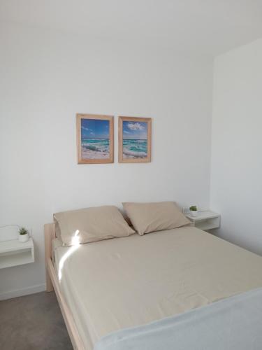 Ένα ή περισσότερα κρεβάτια σε δωμάτιο στο Casa de Mar
