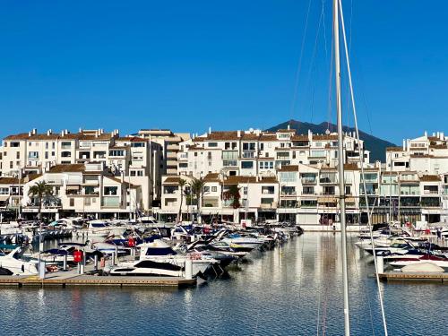 a bunch of boats are docked in a marina at Luxury Puerto Banus Penthouse With Parking & WI-FI in Marbella