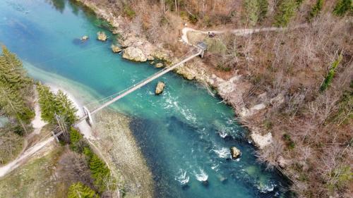 an aerial view of a river with a bridge at Riverhouse apartment in Radovljica