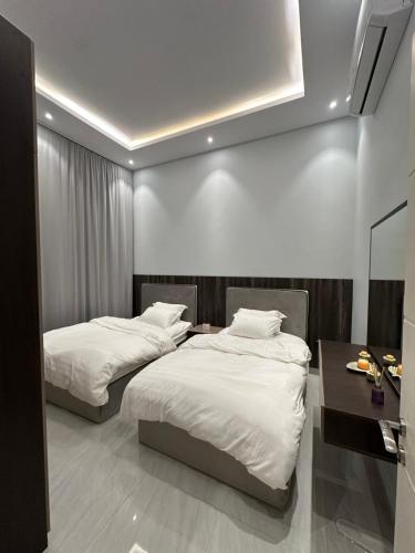 Katil atau katil-katil dalam bilik di شقه مودرن أنيقة