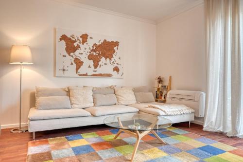 a living room with a couch and a glass table at Encarnação Funchal, a Home in Madeira in Funchal