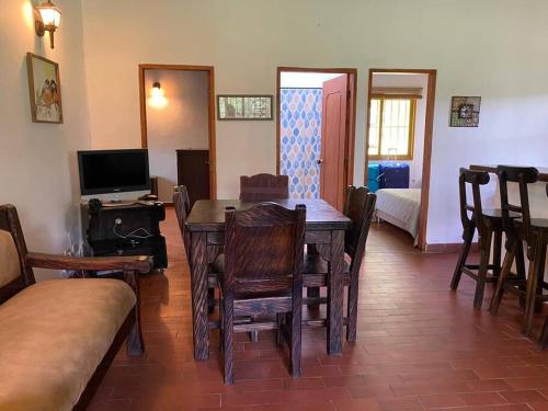 a dining room with a wooden table and chairs at Beautiful Country House located in Llanogrande in Rionegro