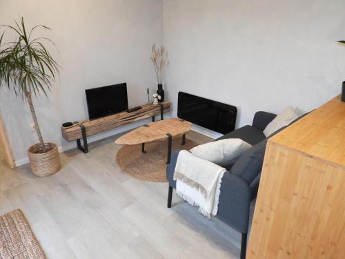 a living room with a couch and a table at Casita en el Campo in Narón