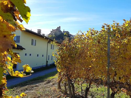 a white building with trees in front of it at Ciabot delle Aie - Barolo in Barolo