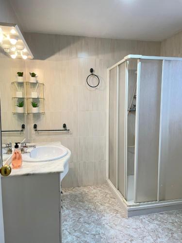 a bathroom with a shower and a sink at UIM Mediterraneo Pablo Iglesias Wifi in Puerto de Sagunto