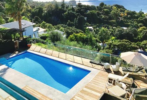 a swimming pool in front of a house at Villa Blanca in Palm Beach in Palm Beach