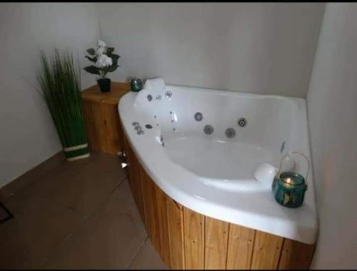 a large white bath tub in a bathroom at depto pinamar in Pinamar