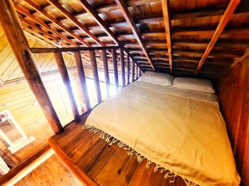 Giường trong phòng chung tại Casa na praia - Chalet Paraiso Canoa